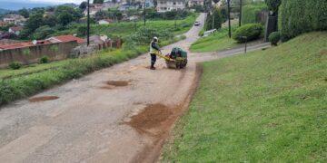 A worker filling potholes on Lukhozi Street in Thembelihle, Mbabane, during recent repairs. Photo by Adekunle Owolabi.
