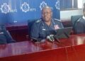 NATCOM Vusi Manoma Masango flanked by police top brass during public briefing. Photo by Samkelisiwe Mavimbela