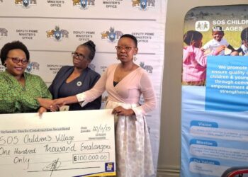 SOS Children's Villages Eswatini Director Andile Phindile Nhleko-Makama recieving the donation.