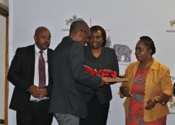 Sister Andrew Jele receiving his certificate of recognition. Photo, Samkelisiwe Mavimbela