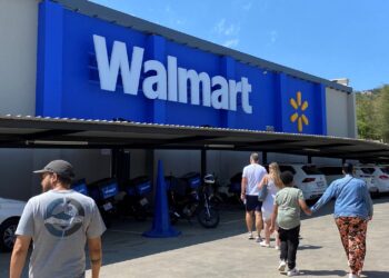 Shoppers arrive at the first Walmart store in South Africa during its opening in Roodepoort, west of Johannesburg, South Africa, November 22, 2025. REUTERS/Siyanda Mthethwa