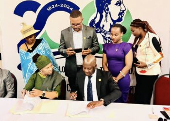 Two representatives from the Ministry of Tourism of Lesotho and the African Tourism Board sign a historic MOU to boost tourism in Africa. Photo by Adv Julius Motsoari