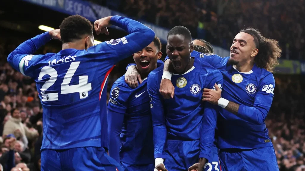 Chelsea players celebrate holding Arsenal to a 1-1 draw at Stamford Bridge despite being a man down