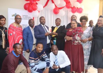 Minister S’khumbuzo Dlamini and NERCHA representatives join community members during the candle lighting ceremony to mark World AIDS Day in Mbabane.