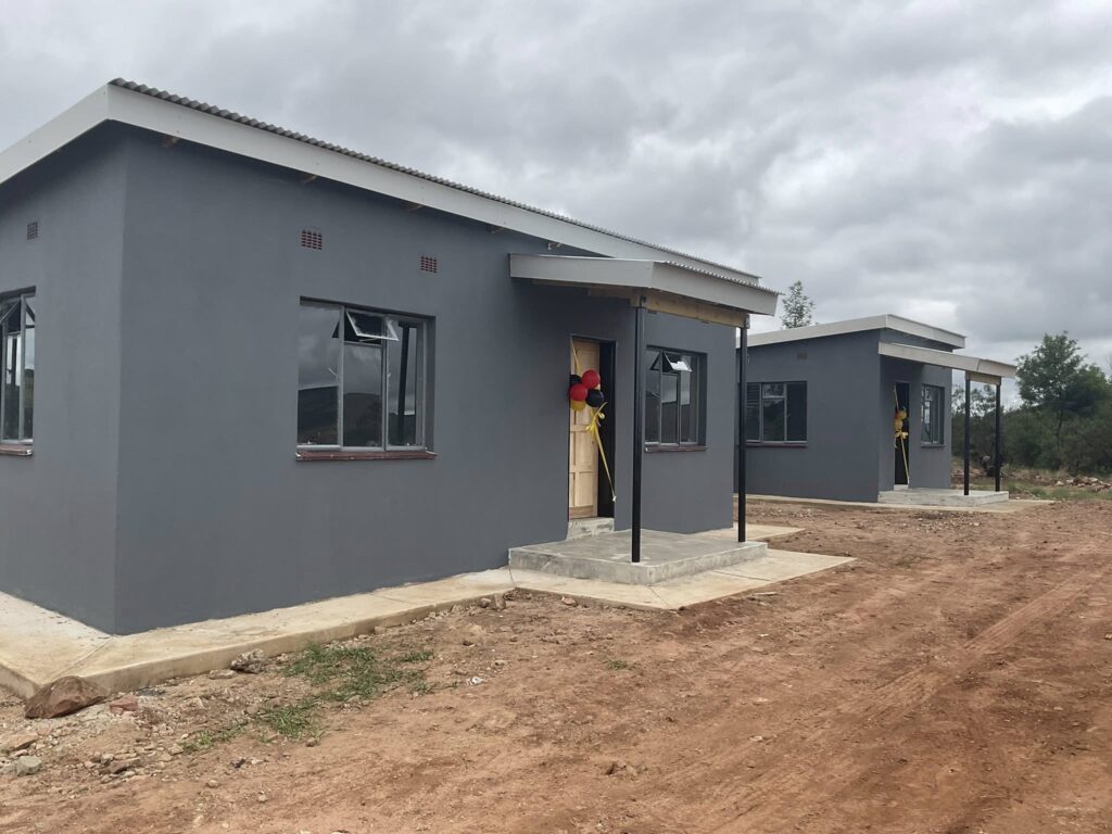 Newly completed homes handed over to displaced Mbondzela Farm families.