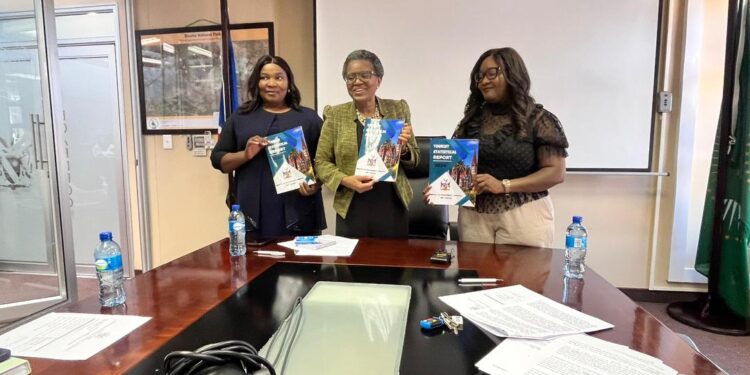 Minister Indileni Daniel holding the 2024 Annual Tourism Statistical Report. Photo by Ministry of Environment and Tourism