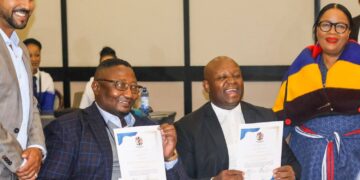 Officials from Lesotho and South Africa holding the signed MoUs during the Lesotho–South Africa Business Council inauguration. Photo by Lesotho Government