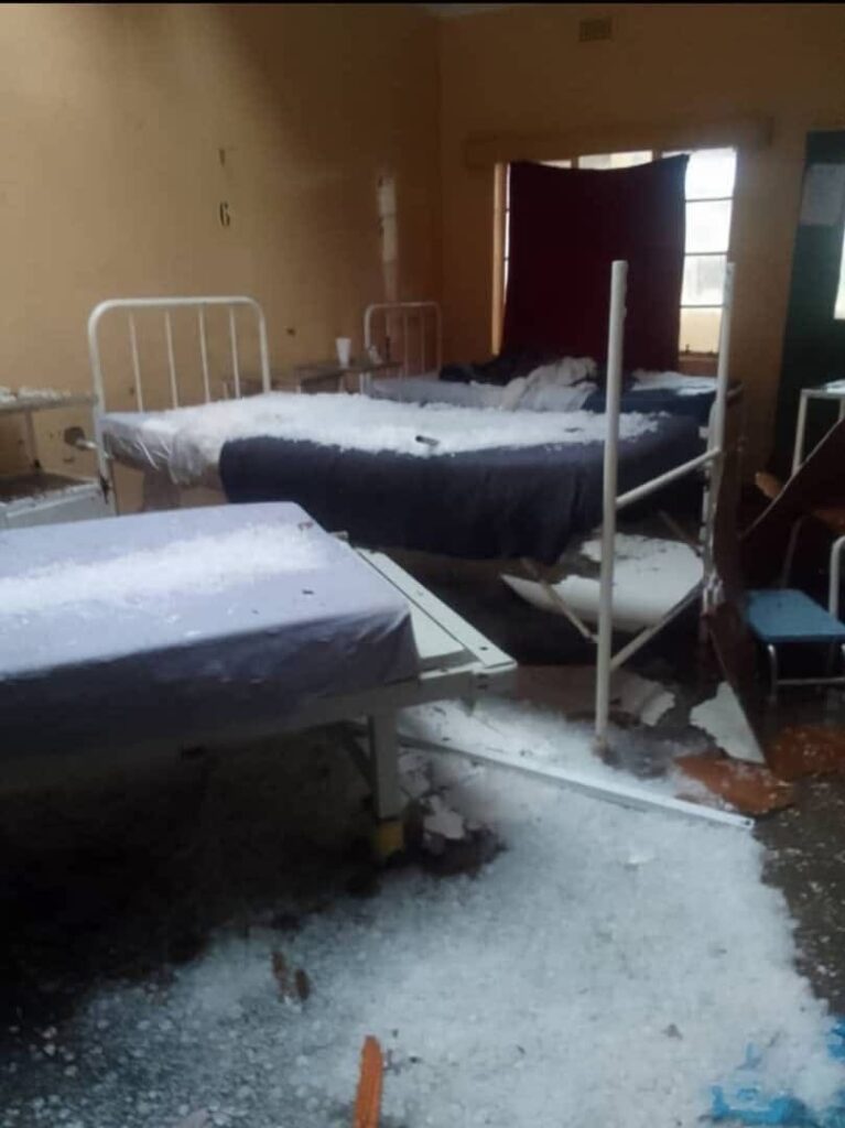 Residents survey the destruction caused by the hailstorm in Buhleni and Mkhuzweni, with damaged homes, destroyed crops, and overturned livestock visible across the community.