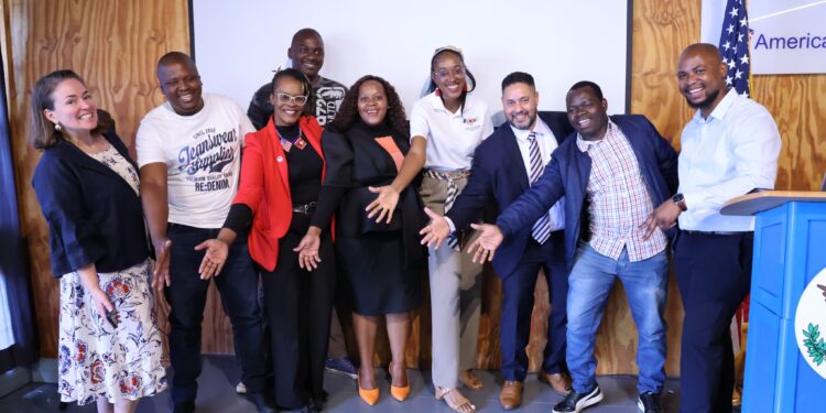Marc Weinstock, U.S. Chargé d’Affaires in Eswatini, Carly Van Orman, Public Affairs Officer, Bertha Sithole, Chairperson of the U.S. Government Exchange Programs Alumni Association, and other alumni and delegates at the launch of the $12,000 U.S. Alumni Grant at American Corner Mbabane. Photo credit: U.S. Embassy Eswatini