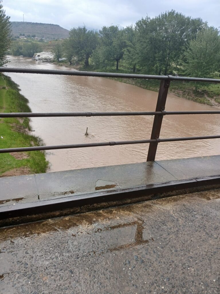 The swollen Tele River in Quthing where heavy rains have made informal crossings unsafe for travellers. Photo by LENA