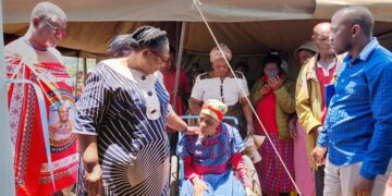 Deputy Prime Minister Thulisile Dladla engages with one of the recipients of the new homes during the handover ceremony in Mpolonjeni. Photo credit: DPMO.