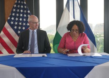 Lesotho Minister of Finance Dr Retšelisitsoe Matlanyane and US Embassy Chargé d’Affaires Thomas Hines sign the bilateral health cooperation agreement during a ceremony in Maseru. Photo by US Embassy Maseru.