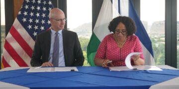 Lesotho Minister of Finance Dr Retšelisitsoe Matlanyane and US Embassy Chargé d’Affaires Thomas Hines sign the bilateral health cooperation agreement during a ceremony in Maseru. Photo by US Embassy Maseru.