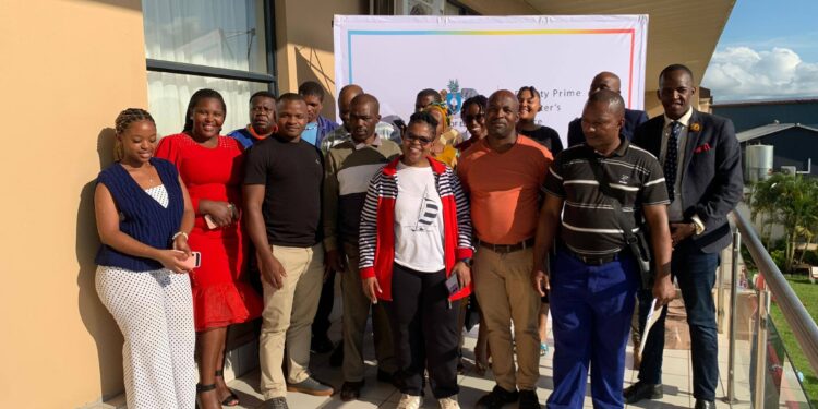 DPM Disability Unit staff and workshop participants gather at The George Hotel after completing the capacity building training. Photo credit DPMO