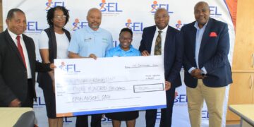 Representatives from Autism Eswatini receive a E100,000 cheque from Swazi Empowerment Limited during a handover ceremony supporting the Autism Care Centre project at Luhlokohla in Ngculwini. Photo Autism Eswatini
