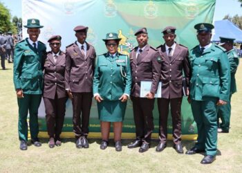 HMCS Commissioner General LaMakhosini Phindile Dlamini poses with officers from His Majesty’s Correctional Services at the MLDCC 8 graduation. Photo credit HMCS