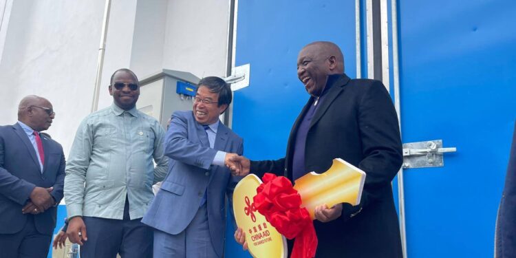 Chinese Ambassador to Lesotho Yang Xiaokun hands over a symbolic key to Prime Minister Ntsokoane Matekane during the official handover of the new agricultural storage and logistics facility at Ha Foso in Maseru.
