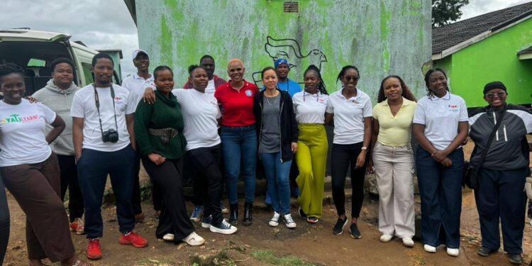 U.S. Marines and US Programs Alumni pose for a group photo after spreading holiday cheer at Gogo Nde’s home in Shiselweni. Photo by U.S. Embassy Eswatini