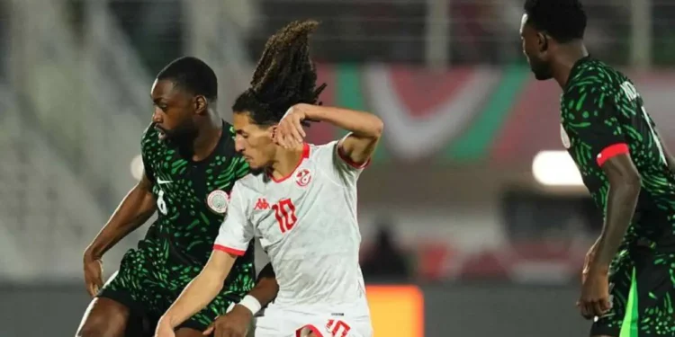 Nigeria defender Semi Ajayi challenges Tunisia midfielder Hannibal Mejbri during their Group C Africa Cup of Nations clash at the Stade de Fes in Morocco.