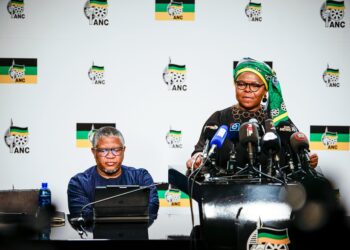 ANC spokesperson Mahlengi Bhengu addresses the media on the outcomes of the party’s NEC meeting held from 1 to 4 August, with secretary general Fikile Mbalula in the background. Photo X/@BhenguMahlengi.