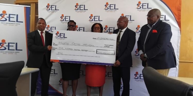 Swazi Empowerment Limited representatives handing over the E700,000 donation to beneficiaries during the cheque presentation ceremony