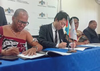 The PS in the DPMO's and JICA representative during the signing ceremony