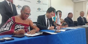 The PS in the DPMO's and JICA representative during the signing ceremony