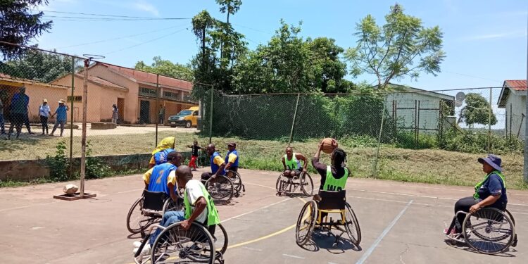 Persons with disabilities playing basketball during the sports day at Zakhele. Pic by Samkelisiwe Mavimbela