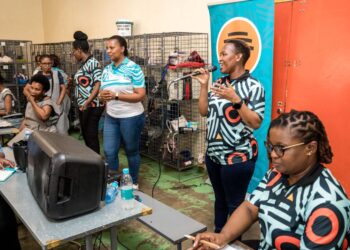 FNB Eswatini staff engage textile workers in Matsapha during a fraud awareness activation focused on safe banking and scam prevention. Photo by FNB Eswatini.