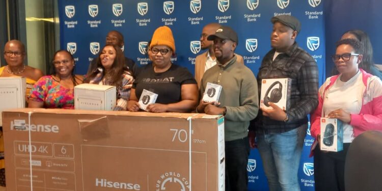 Winners of the Choose Standard Bank campaign pose for a group photo during the prize-giving event. Photo by Khulekile Mhlanga