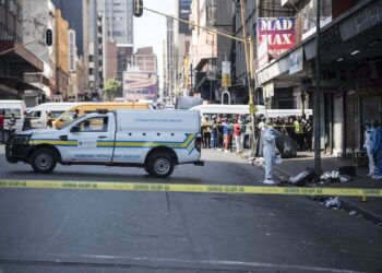 A forensic pathology van prepares to remove the body. Picture: Michel Bega/The Citizen