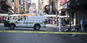 A forensic pathology van prepares to remove the body. Picture: Michel Bega/The Citizen