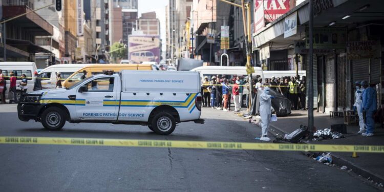 A forensic pathology van prepares to remove the body. Picture: Michel Bega/The Citizen