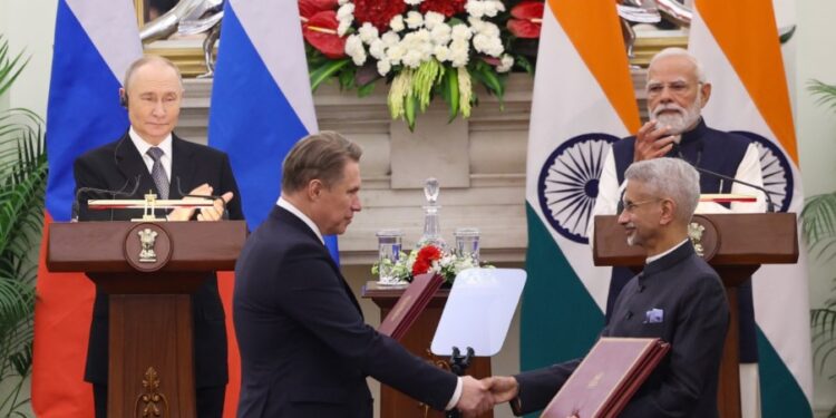 Vladimir Putin and Narendra Modi watch as both ministers exchange the memorandum of understanding Photo by X/@narendramodi