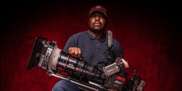 Ofentse Mwase poses with an ARRI camera on set. Photo Ofentse Mwase