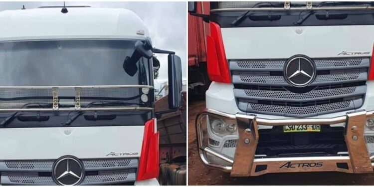 white and red Mercedes truck, registered LSD 233 DH