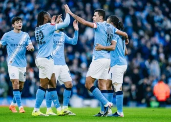 Manchester City players celebrate together after reaching double figures in their FA Cup third round victory over Exeter City at the Etihad Stadium.