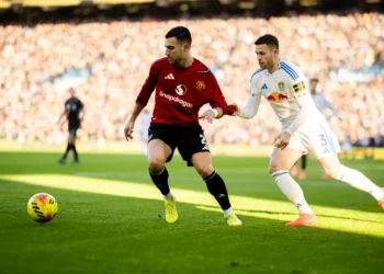 José Diogo Dalot Teixeira of Manchester United battles for possession with Leeds United’s Gabriel Gudmundsson during their Premier League encounter at Elland Road.