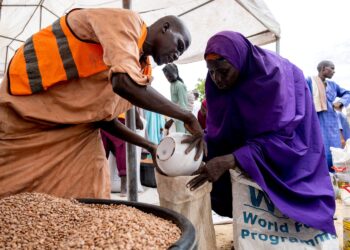 Yaanama Abba, a 45-year-old mother of six children, receives pinto beans distributed by WFP in Mafa LGA, Borno State, Nigeria, July 16, 2025. Damilola Onafuwa, WFP Nigeria Communications Service/Handout via REUTERS/File Photo