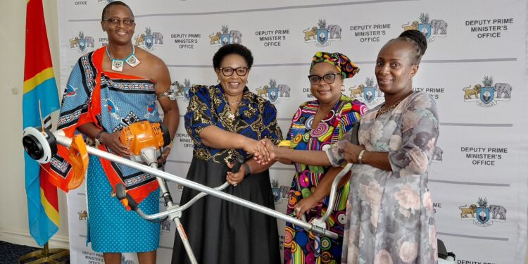 Deputy Prime Minister Thulisile Dladla hands over grass brush cutter machines to Lobamba High School and Eric Rosenberg High School during a donation ceremony. Photo by: DPMO