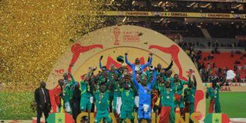 Senegal players celebrate as they lift the TotalEnergies CAF Africa Cup of Nations Morocco 2025 trophy after the final.