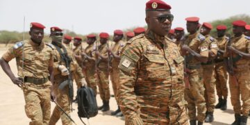 Burkina Faso President Lieutenant Colonel Paul-Henri Damiba is welcomed by soldiers in Dori, Sahel region as he arrives to motivate his troops, after armed men killed civilians and militaries in Seytenga, at an airport in Dori, Burkina Faso June 15, 2022. Burkina Faso's Presidential Press Service/Handout via REUTERS/File Photo