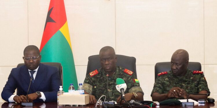 From L-R, Guinea-Bissau's Prime Minister Ilidio Vieira Te, transitional president Major-General Horta Inta-a and Major-General Tomas Djassi, chief of staff of the Armed Forces, attend a press conference in Bissau, Guinea-Bissau, December 19, 2025. REUTERS/Delcyo Sanca/File Photo