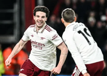 Declan Rice and Leandro Trossard celebrate after Rice's stunning second-half brace sealed Arsenal's 3-2 win over Bournemouth.