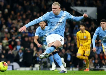 Haaland steps up to convert a crucial penalty for Manchester City against Brighton.