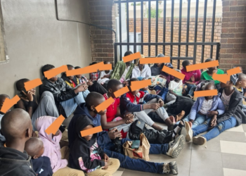 The suspect arrested for attempting to smuggle a South African child into Mozambique is held by authorities at the Lebombo Port of Entry. Photo by X/@TheBMA_SA