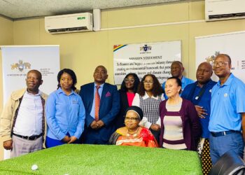 Minister of Tourism and Enviomental Affairs Jane Mkhonta-Simelane posing for the lenses with the newly appointed King Golf Cup task team
