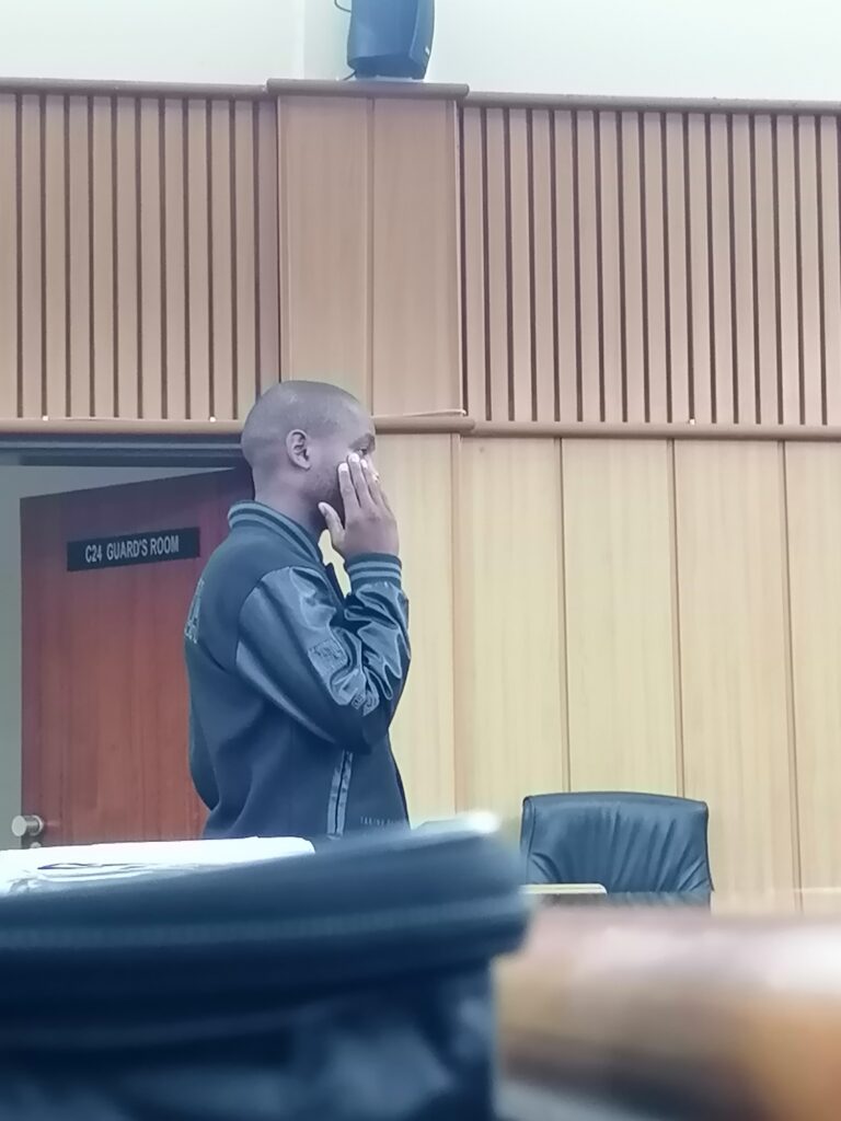 Siboniso Sikhondze pictured in black following his arrest on charges of driving under the influence and operating a vehicle without registration plates.