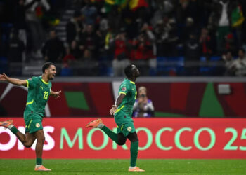 Sadio Mané celebrates his winning goal for Senegal at Ibn Batouta Stadium.