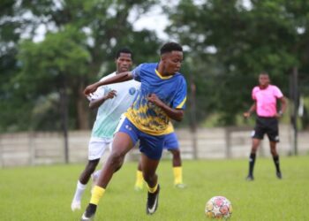 Ludzeludze Killers FC and Lozitha Spurs FC battle for possession during their MulaSport National First Division